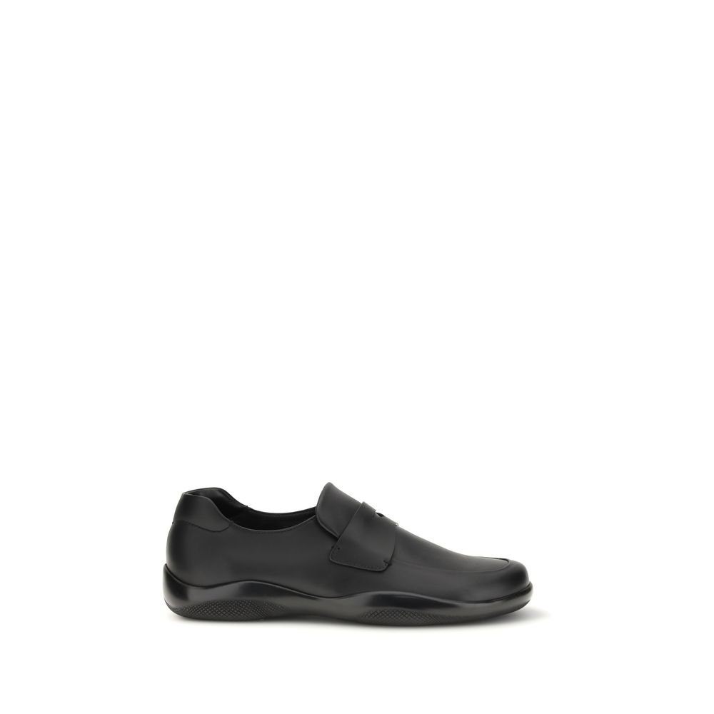 9976040.jpeg Prada Black Calf Leather Bos Taurus Slip-On Loafers - Image 1
